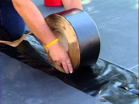 Firestone EPDM Batten Cover Tape, 6-inch by 100-foot roll, used for waterproof roofing and installation of EPDM roofing systems.