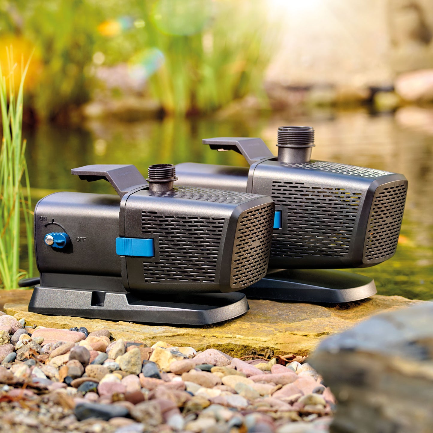 Oase Aquarius Eco Premium 2600 pond pump showing compact design and inlet and outlet ports for water circulation.