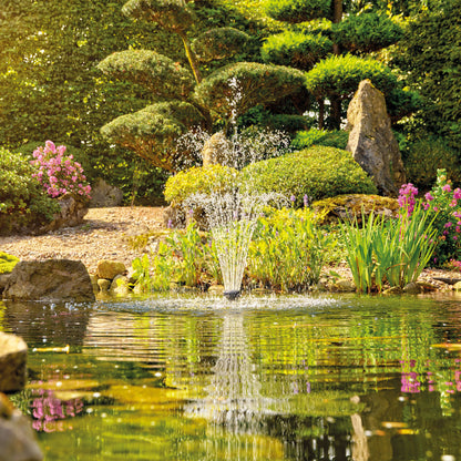 Oase Aquarius Eco Premium 3700 pond pump in use, showcasing its compact design and durable build for pond water circulation.